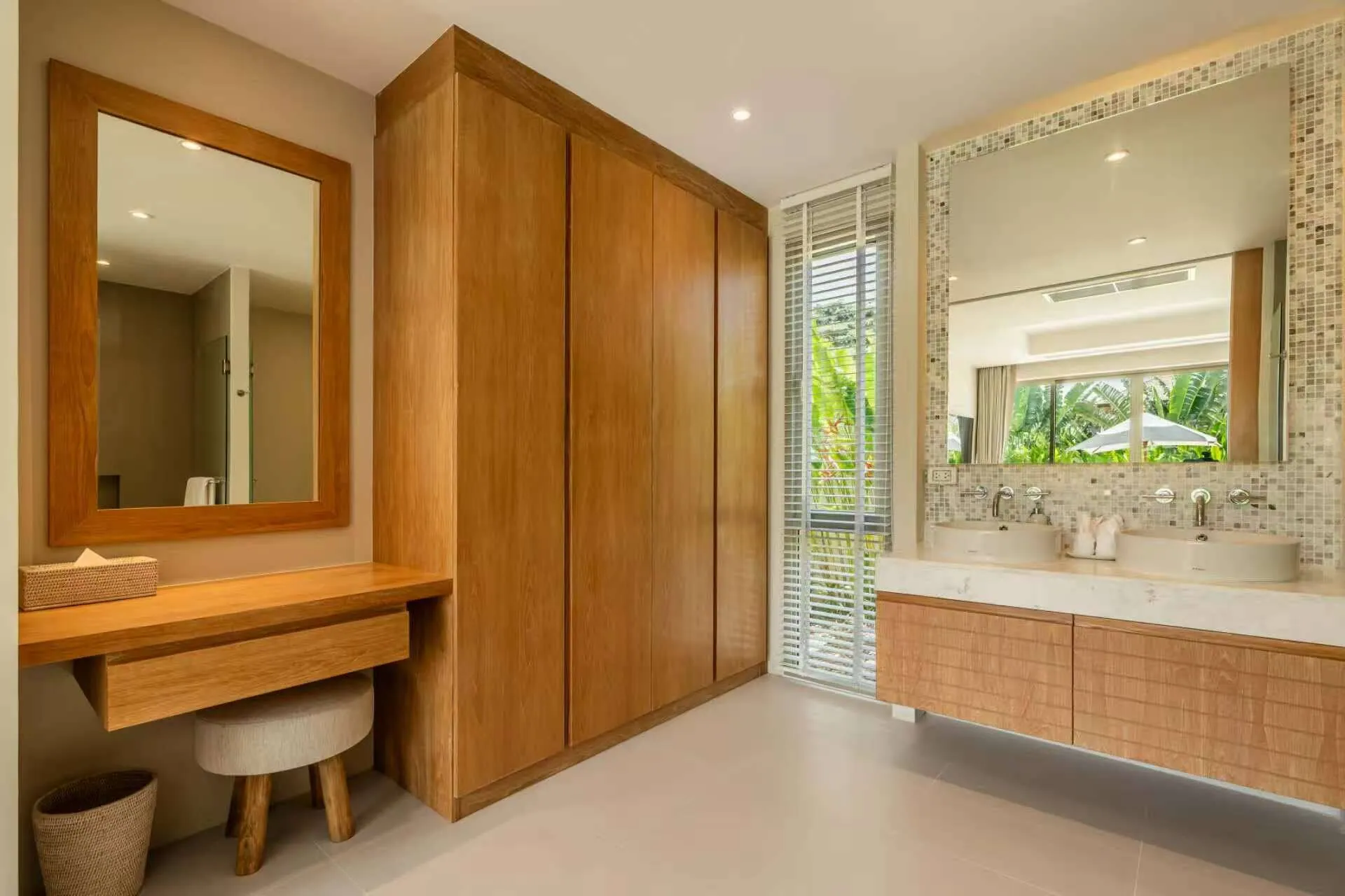Bathroom with a dressing table, a built-in wardrobe and a twin-basin vanity