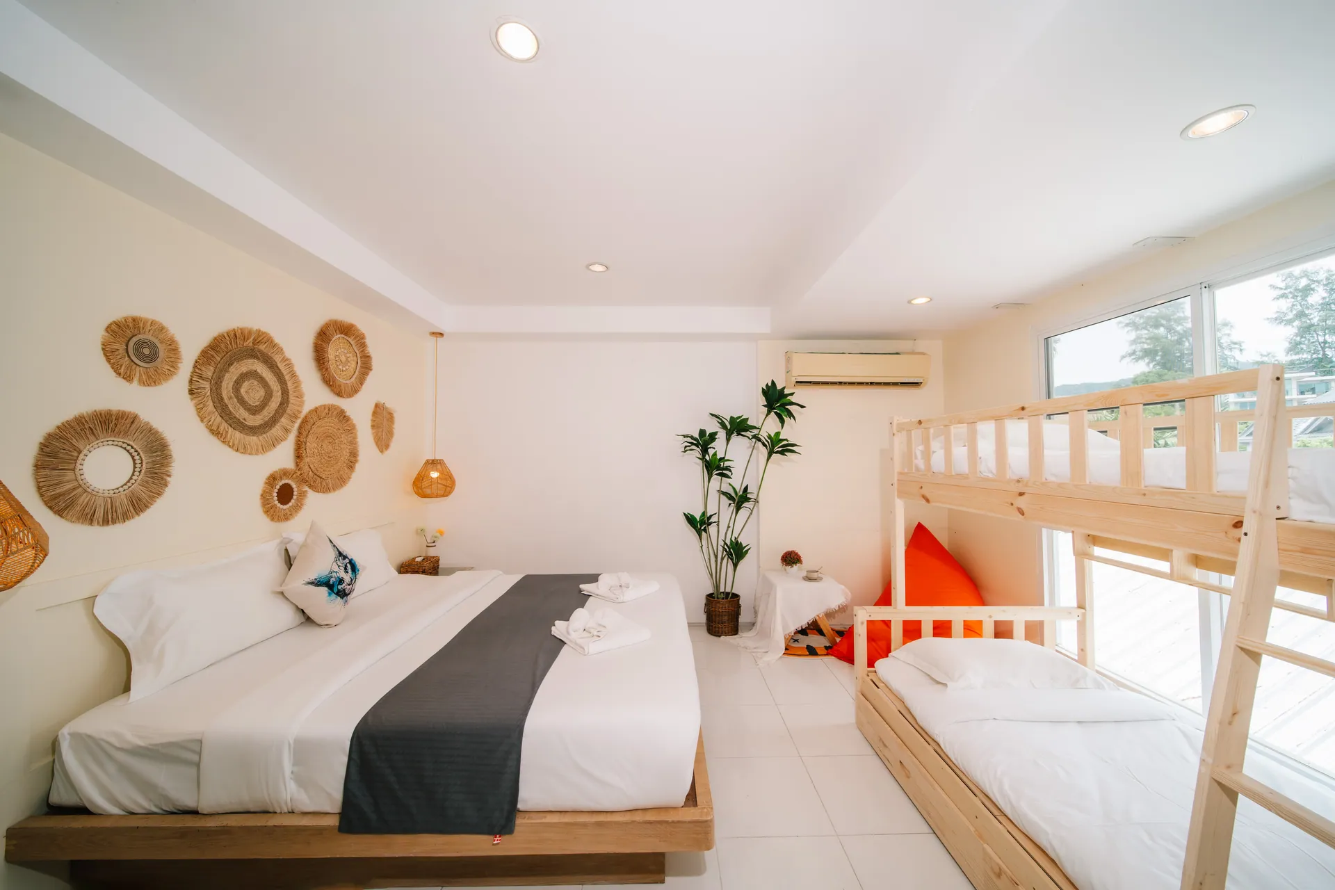 Family Room with a king bed and a bunk bed beneath woven wall plates