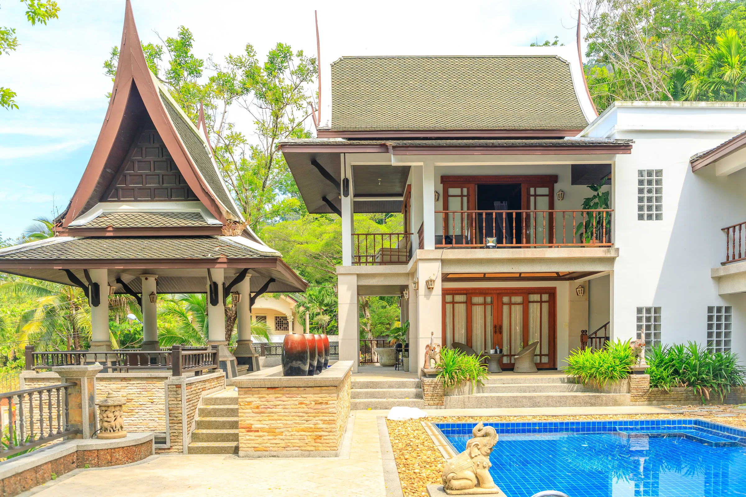Thai sala pavilion and the main house above the private pool