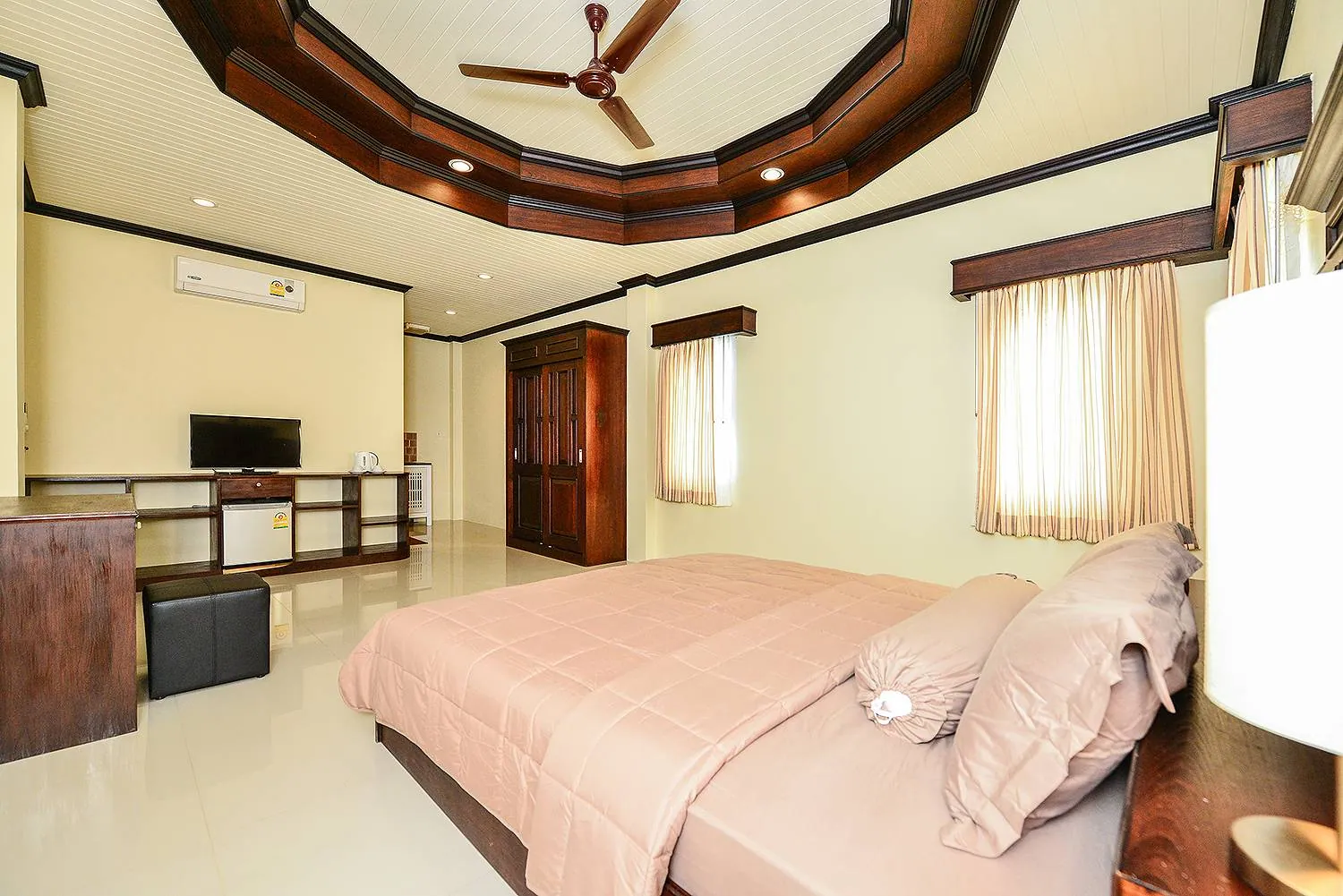 Bedroom with a king bed, a TV and a wardrobe