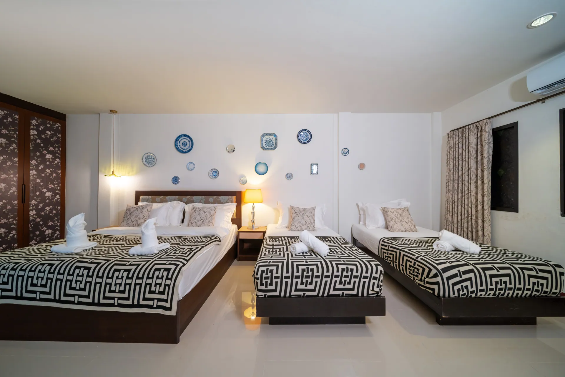 Family Room with a king bed and two single beds in a row